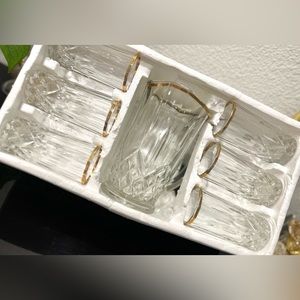 New Set Of Gold And Crystal Glasses And Jug